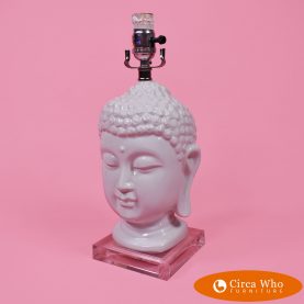 Lamp with the face of Buddha in white color and lucite base