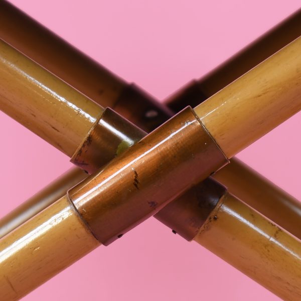 "Detail of pink velvet seat and bamboo armrest"