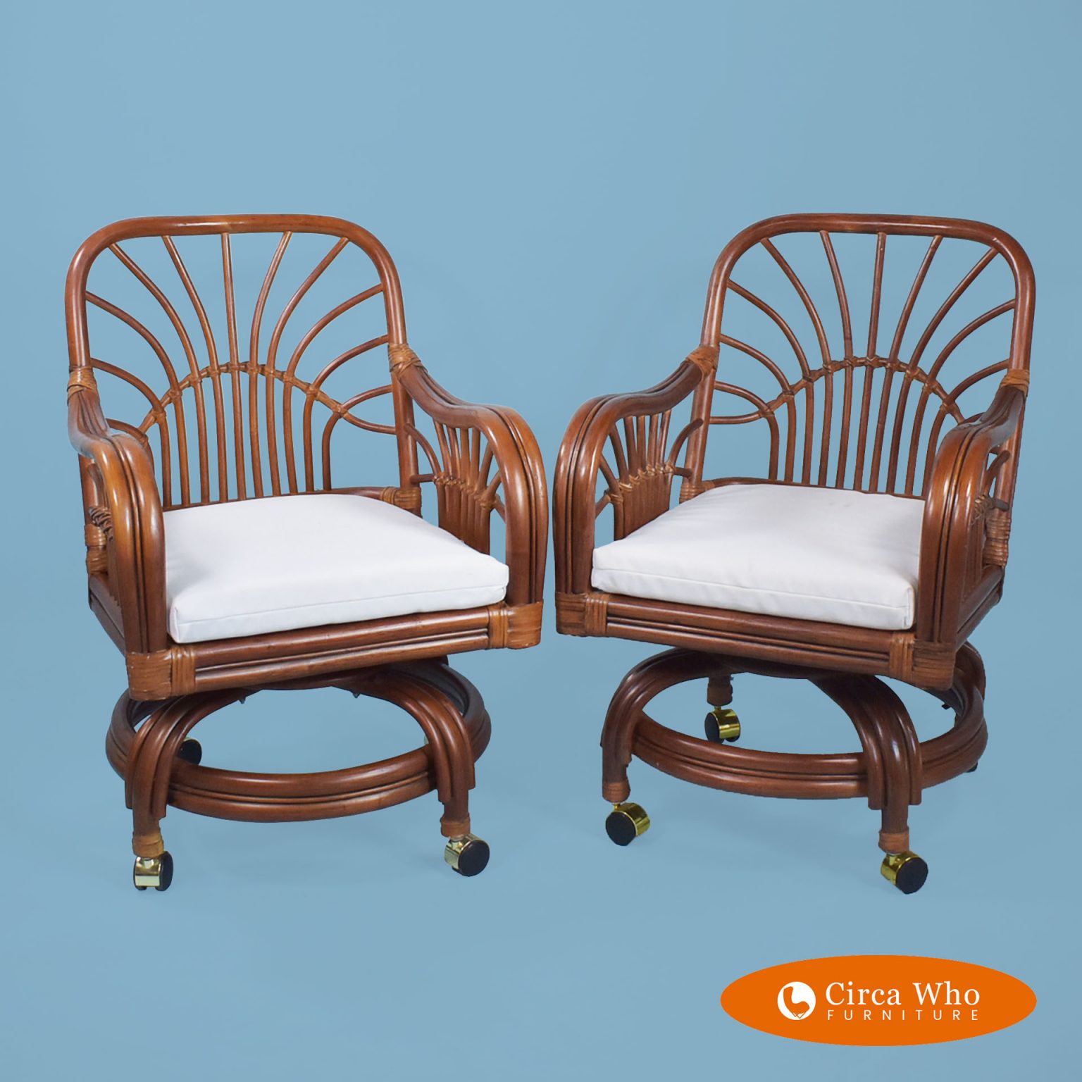 Pair of Fretwork Rattan Chairs in Casters Circa Who