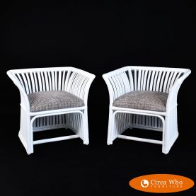 Pair of white low back rattan chairs
