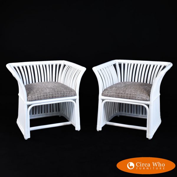Pair of white low back rattan chairs