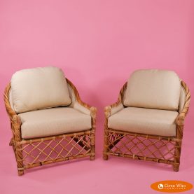 pair of twisted rattan lounge chairs in vintage condition