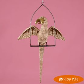 Parrot in a swing by the Mexican artist Mario Lopez Torres