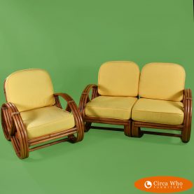 Pretzel rattan settee and chair upholsteryin yellow with a brown natural color in the wood
