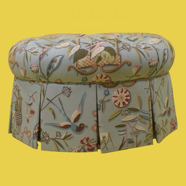 Round Upholstered Ottoman in Casters